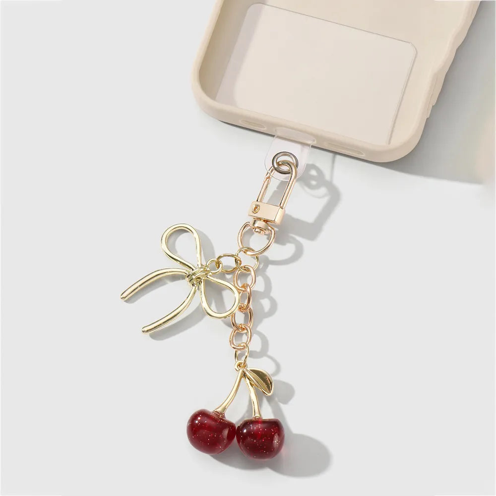 Kersen bag chain met strik - Goud en rood